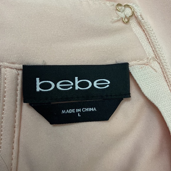 Bebe pink frills dress lace. Large but fits as a Medium. - Picture 3 of 4